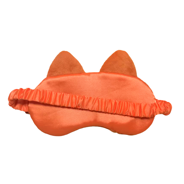An orange cat-themed sleep mask with plush ears and a ruffled elastic band, shown against a plain white background.