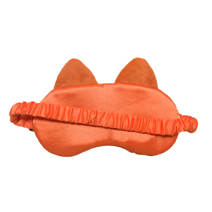 An orange cat-themed sleep mask with plush ears and a ruffled elastic band, shown against a plain white background.