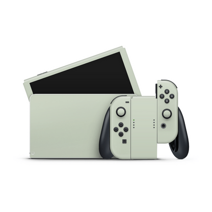 Sage Green Nintendo Switch OLED skin with soft muted green tone on matte vinyl